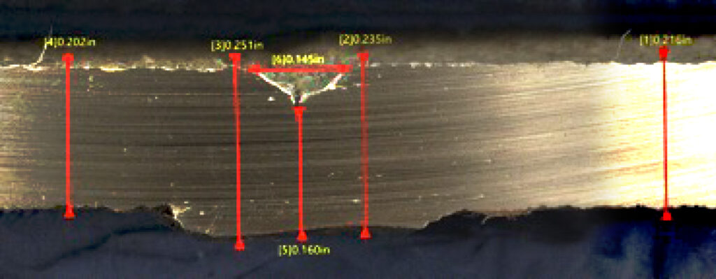Photo of the slice of pipe showing the area of volumetric metal loss present in the data example.
